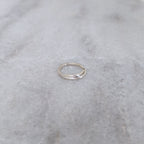 Silver vine ring on a marble surface